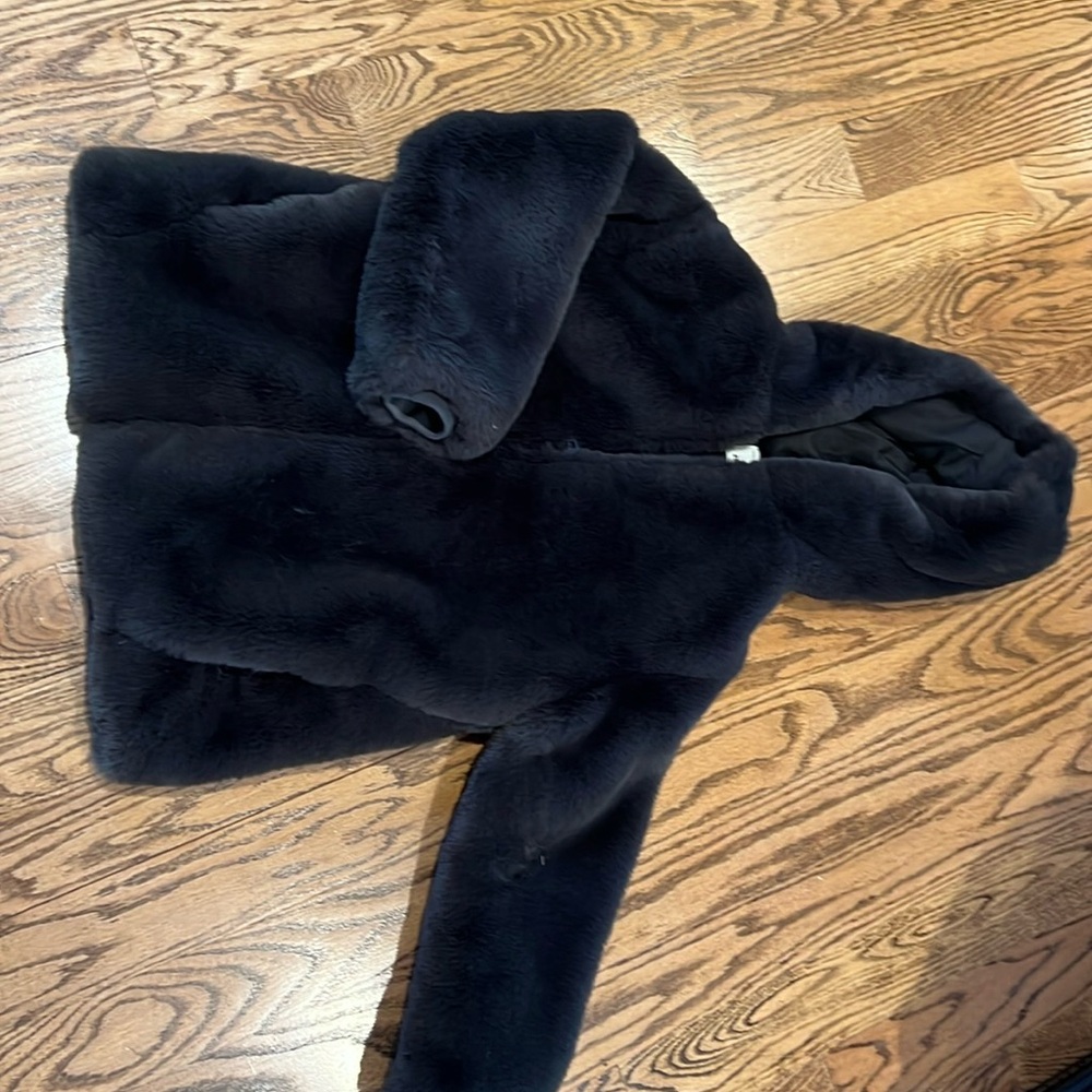 Never worn, faux fur chocolate hooded zip coat.  Short but longer than crop,